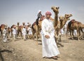 Omani men with camels after a race