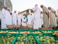 Omani Men selling fresh fruits in fruit bid market