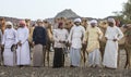 Omani men with their camels in a countryside Royalty Free Stock Photo