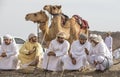 Omani men with their camels before a race