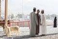 Omani people at a traditional goat market Royalty Free Stock Photo