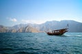 An Omani traditional dhow boat sailing across Musandam sea. Royalty Free Stock Photo