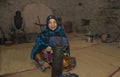 Omani woman making traditional bracelets