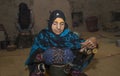 Omani woman making traditional bracelets