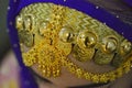 Omani women traditional gold wear with omani costume