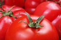 Omato texture. Fresh big red tomatoes closeup background photo. Pile of tomatoes. Tomato pattern with studio lights.