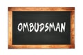 OMBUDSMAN text written on wooden frame school blackboard