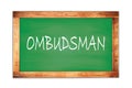 OMBUDSMAN text written on green school board