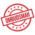 OMBUDSMAN text written on red vintage round stamp