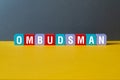 Ombudsman - word concept on cubes Royalty Free Stock Photo