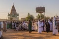 OMDURMAN, SUDAN - MARCH 8, 2019: People watch Sufi Whirling Dervishes during a religious ceremony at Hamed al Nil