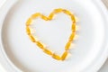 Omega 3 pills in a shape of heart Royalty Free Stock Photo