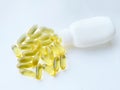 Omega-3 capsules with the bottle on white background. Polyunsaturated fatty acids. The concept of a healthy lifestyle