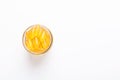 Omega 3 capsules in glass jar on white background Fish oil Yellow softgels Vitamin D, E, A supplement Royalty Free Stock Photo