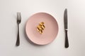 Omega 3 capsules on a plate Royalty Free Stock Photo