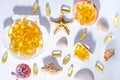 Omega 3 capsules and seashells with long shadows. Top view photo of supplement food with oil of nordic fish. Vitamins and tablets