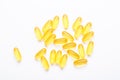 Omega 3 capsules on white background Fish oil Yellow softgels Vitamin D, E, A supplement Concept of healthcare Royalty Free Stock Photo