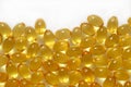 Omega-3 fish fat oil capsules close up on a white