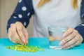 Omega 3 fish oil capsules spilling out of a bottle on a blue background. selective focus Royalty Free Stock Photo