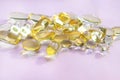 Omega 3 fish oil gel capsules, vitamin D. Close-up medicine yellow transparent pills, omega 3 fish oil capsules, vitamin Royalty Free Stock Photo