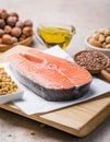 Omega 3 food sources and omega 6 on concrete background, top view copy space. Foods high in fatty acids including vegetables, Royalty Free Stock Photo