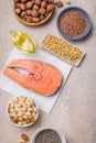 Omega 3 food sources and omega 6 on concrete background, top view copy space. Foods high in fatty acids including vegetables, Royalty Free Stock Photo