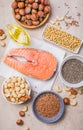 Omega 3 food sources and omega 6 on concrete background, top view copy space. Foods high in fatty acids including vegetables, Royalty Free Stock Photo