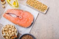 Omega 3 food sources and omega 6 on concrete background, top view copy space. Foods high in fatty acids including vegetables, Royalty Free Stock Photo