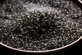 Omega 3 food supplements. Bowl of Raw Black Chia Seeds, a Superfood with Omega-3. Omega-3 Rich Chia Seeds Close-up, a Healthy food