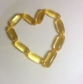 Omega pills in shape of heart Royalty Free Stock Photo