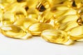 Omega 3 vitamin yellow supplement gel capsules or Fish Oil on white background, Cod liver oil medicines, macro shot Royalty Free Stock Photo