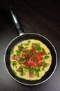 Omelet bacon slices, tomatoes with herbs