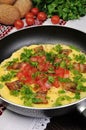 Omelet bacon slices, tomatoes with herbs