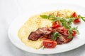 Omelet with bacon and tomatoes on white background Royalty Free Stock Photo