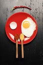 Omelet and eggshell make smiling face image. Dish with egg Royalty Free Stock Photo