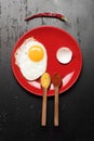 Omelet and eggshell make smiling face image. Dish with egg Royalty Free Stock Photo