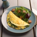 Omelet with greens close-up on a plate