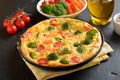 Omelet with herbs, broccoli and fresh tomatoes Royalty Free Stock Photo