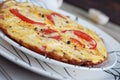 Omelet with onion, tomatoes and mushrooms