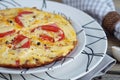 Omelet with onion, tomatoes and mushrooms