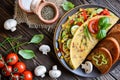 Omelet with pepper, tomato, corn, green onion, cucumber, mushrooms and fried bread Royalty Free Stock Photo