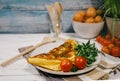 Omelet with ruccola and cherry tomatoes Royalty Free Stock Photo