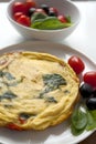 Omelet with spinach olives and cherry tomatoes