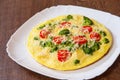 Omelet with tomato, broccoli and cheese Royalty Free Stock Photo