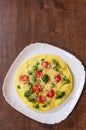 Omelet with tomato, broccoli and cheese Royalty Free Stock Photo