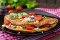 Omelet with tomatoes, parsley and feta cheese