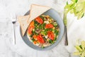 Omelet with vagetable, tomatoes, mushrooms,green beans, pease, corn, sourdough toast on white marble background. Homemade