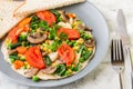 Omelet with vagetable, tomatoes, mushrooms,green beans, pease, corn, sourdough toast isolated on white marble background. Homemade