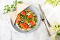 Omelet with vagetable, tomatoes, mushrooms,green beans, pease, corn, sourdough toast on white marble background. Homemade