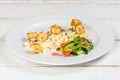 Omelet with vegetables and fresh herbs on a white plate Royalty Free Stock Photo